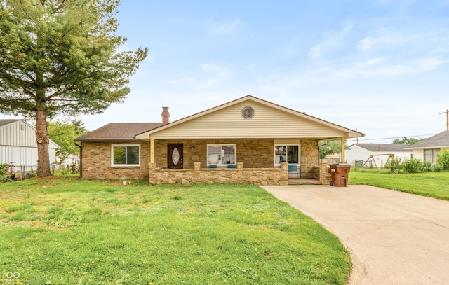 521 Sunset Dr, Edinburgh, IN 46124 - view of front of house with a front yard, stone siding, a chimney, and covered porch