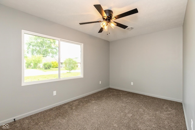 521 Sunset Dr, Edinburgh, IN 46124 - spare room with carpet, baseboards, and a ceiling fan
