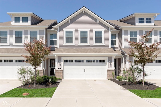 1280 Newton St, Avon, IN 46123 - townhome / multi-family property with concrete driveway, a garage, and brick siding
