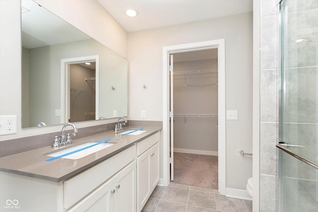1280 Newton St, Avon, IN 46123 - full bath with toilet, double vanity, a walk in closet, recessed lighting, and a shower with shower door