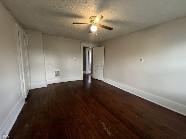 1137 W 34th St, Indianapolis, IN 46208 - spare room with wood-type flooring, baseboards, a ceiling fan, and a textured ceiling