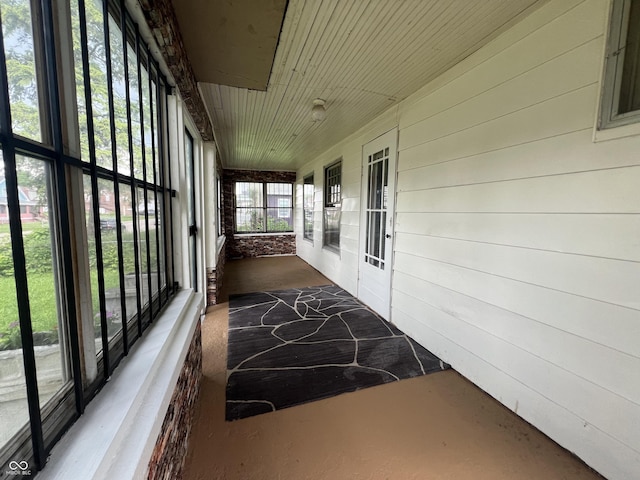 1137 W 34th St, Indianapolis, IN 46208 - unfurnished sunroom featuring wood walls, carpet, and wooden ceiling