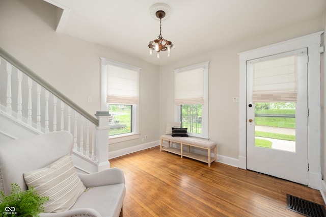 117 S Spencer Ave, Indianapolis, IN 46219 - foyer with light wood-style flooring, baseboards, and stairs