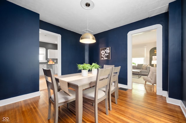 117 S Spencer Ave, Indianapolis, IN 46219 - dining space featuring light wood-type flooring, plenty of natural light, and baseboards