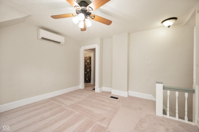 117 S Spencer Ave, Indianapolis, IN 46219 - empty room featuring a wall mounted AC, light colored carpet, ceiling fan, and baseboards