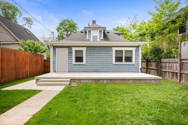 117 S Spencer Ave, Indianapolis, IN 46219 - rear view of property with a deck, roof with shingles, and a chimney