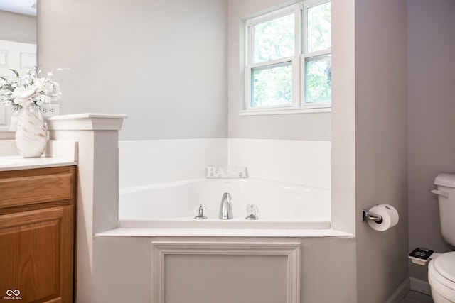8317 Pine Branch Ln, Indianapolis, IN 46234 - bathroom featuring toilet, vanity, and a garden tub