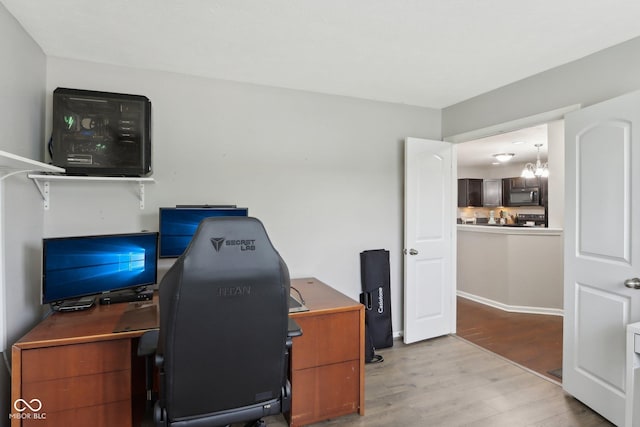 2911 W Hawanian Ln, Monrovia, IN 46157 - home office with wood finished floors and a chandelier