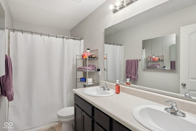 2911 W Hawanian Ln, Monrovia, IN 46157 - bathroom featuring toilet, double vanity, and curtained shower