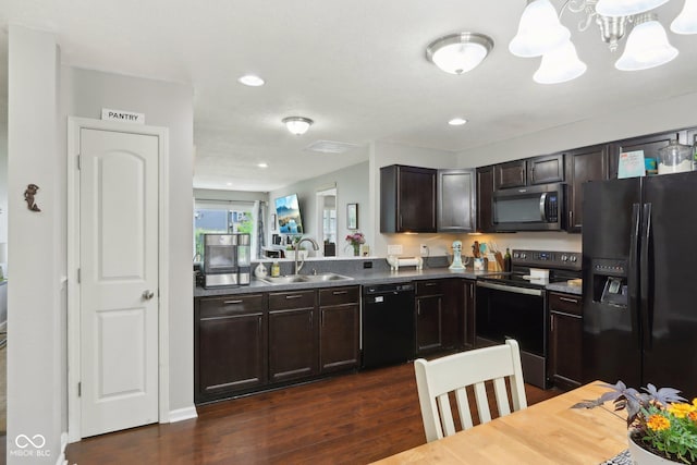 2911 W Hawanian Ln, Monrovia, IN 46157 - kitchen with black appliances, a sink, dark wood-type flooring, dark brown cabinetry, and a chandelier