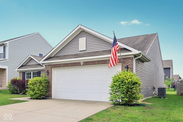 2911 W Hawanian Ln, Monrovia, IN 46157 - view of front of home with an attached garage, central AC unit, driveway, brick siding, and a front lawn