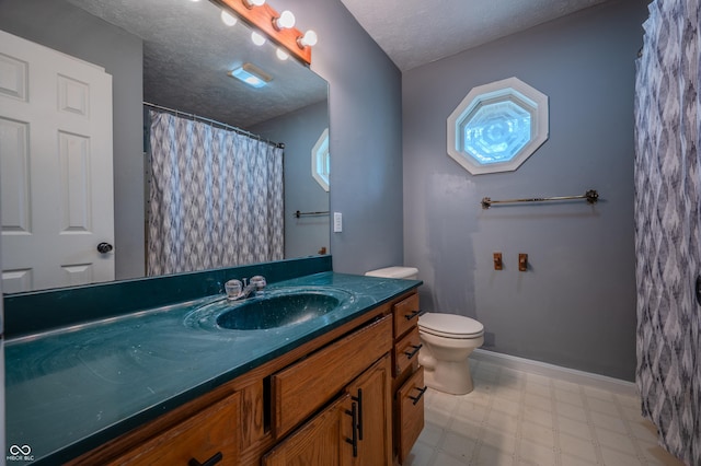 917 Timothy Ct, Bloomington, IN 47403 - full bathroom with tile patterned floors, vanity, toilet, plenty of natural light, and a textured ceiling