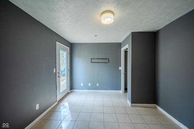 917 Timothy Ct, Bloomington, IN 47403 - unfurnished room featuring a textured ceiling, baseboards, and light tile patterned floors