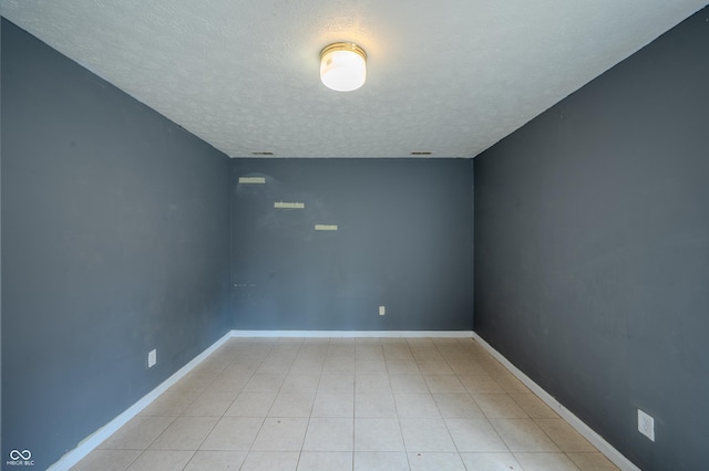 917 Timothy Ct, Bloomington, IN 47403 - unfurnished room with a textured ceiling and baseboards