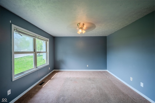 917 Timothy Ct, Bloomington, IN 47403 - carpeted spare room featuring a ceiling fan, a textured ceiling, and baseboards