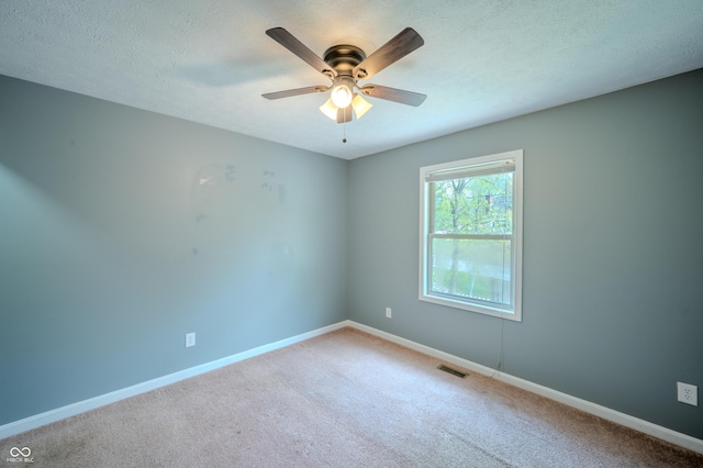 917 Timothy Ct, Bloomington, IN 47403 - empty room with baseboards, ceiling fan, carpet floors, and a textured ceiling