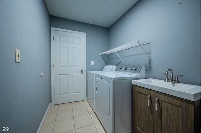 917 Timothy Ct, Bloomington, IN 47403 - laundry room with cabinet space, washer and clothes dryer, baseboards, and light tile patterned floors