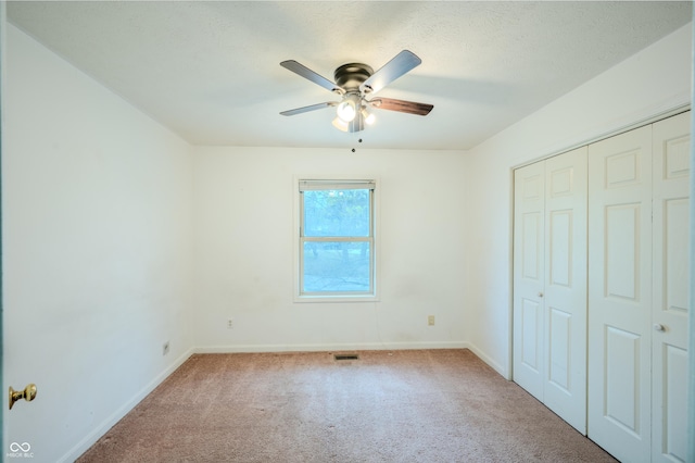 917 Timothy Ct, Bloomington, IN 47403 - unfurnished bedroom featuring carpet flooring, baseboards, a closet, and ceiling fan