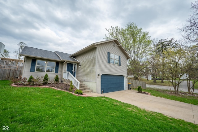 917 Timothy Ct, Bloomington, IN 47403 - tri-level home featuring a garage and concrete driveway