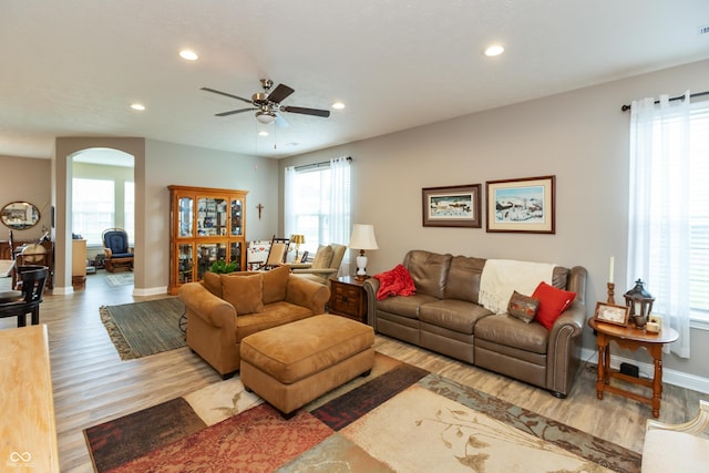 9166 Lieven St, Avon, IN 46123 - living room featuring arched walkways, baseboards, wood finished floors, ceiling fan, and recessed lighting