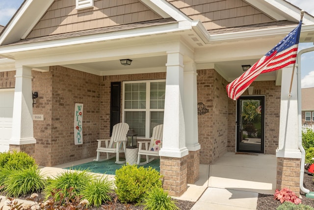 9166 Lieven St, Avon, IN 46123 - view of exterior entry featuring covered porch and brick siding
