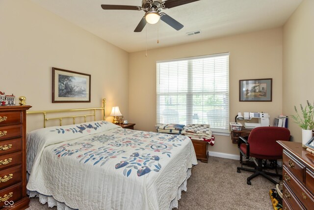 9166 Lieven St, Avon, IN 46123 - bedroom with light colored carpet, an office area, ceiling fan, and baseboards