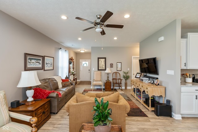 9166 Lieven St, Avon, IN 46123 - living area with light wood-type flooring, ceiling fan, recessed lighting, and baseboards