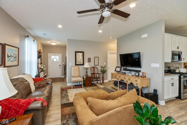 9166 Lieven St, Avon, IN 46123 - living area with light wood-style flooring, recessed lighting, ceiling fan, and baseboards