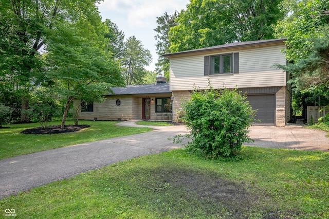2120 Wynnedale Rd, Indianapolis, IN 46228 - view of front of house featuring driveway, an attached garage, and a front yard