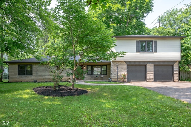 2120 Wynnedale Rd, Indianapolis, IN 46228 - view of front of property with stone siding, asphalt driveway, an attached garage, a front lawn, and a porch