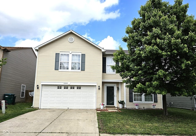 10836 Zimmerman Ln, Indianapolis, IN 46231 - view of front of home featuring concrete driveway, an attached garage, and a front yard