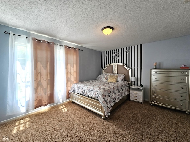 10836 Zimmerman Ln, Indianapolis, IN 46231 - bedroom with a textured ceiling and dark colored carpet