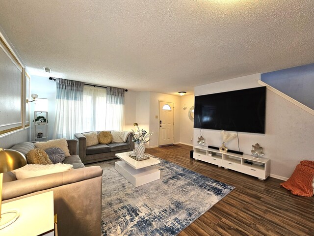 10836 Zimmerman Ln, Indianapolis, IN 46231 - living area featuring a textured ceiling, wood finished floors, and baseboards