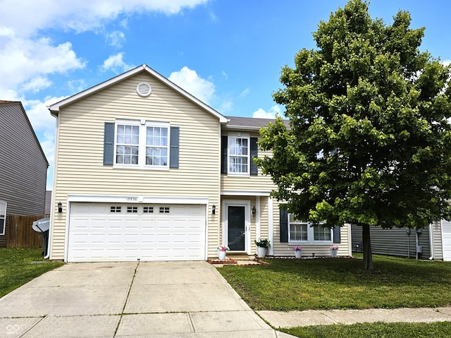 10836 Zimmerman Ln, Indianapolis, IN 46231 - view of front of home featuring concrete driveway, a garage, and a front yard