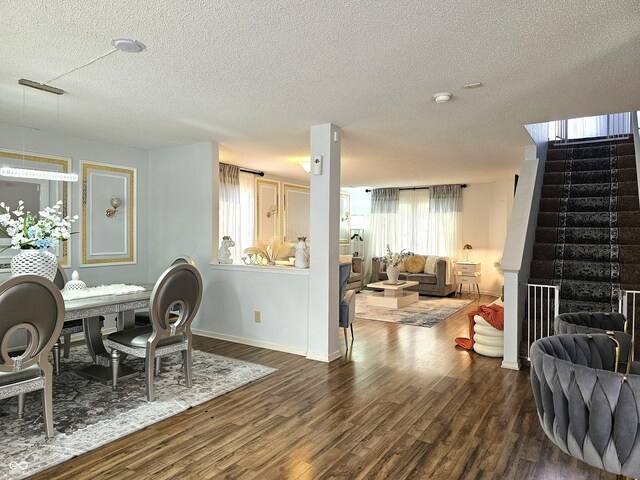 10836 Zimmerman Ln, Indianapolis, IN 46231 - dining space with stairway, wood finished floors, a textured ceiling, and baseboards