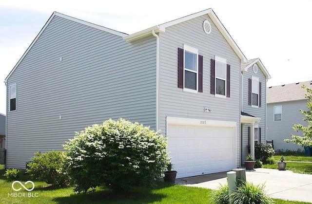 7737 Wolfgang Pl, Indianapolis, IN 46239 - view of front of home with a garage and driveway