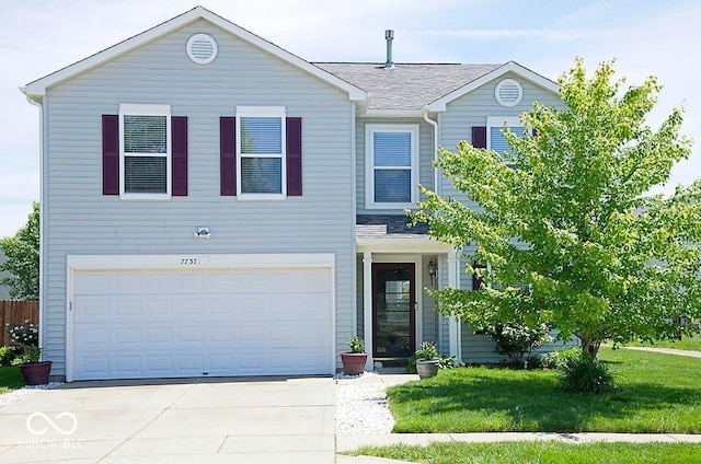 7737 Wolfgang Pl, Indianapolis, IN 46239 - traditional home with an attached garage, driveway, a front yard, and a shingled roof