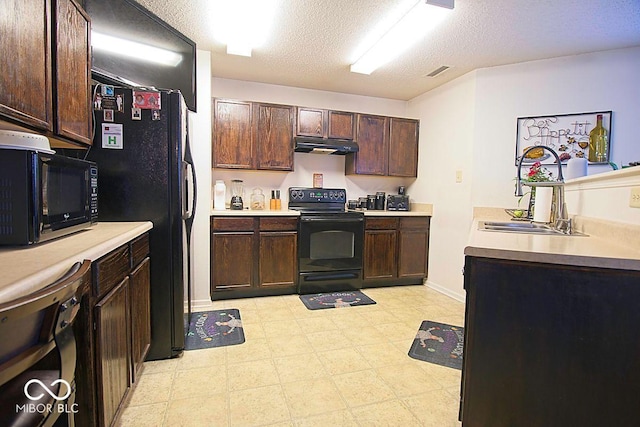 7737 Wolfgang Pl, Indianapolis, IN 46239 - kitchen featuring black appliances, a sink, under cabinet range hood, dark brown cabinetry, and a textured ceiling