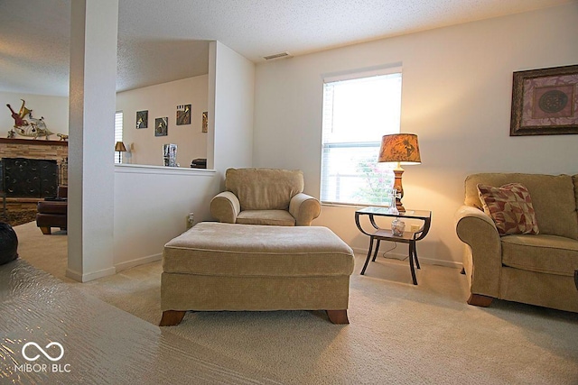 7737 Wolfgang Pl, Indianapolis, IN 46239 - sitting room featuring light colored carpet, plenty of natural light, baseboards, and a textured ceiling