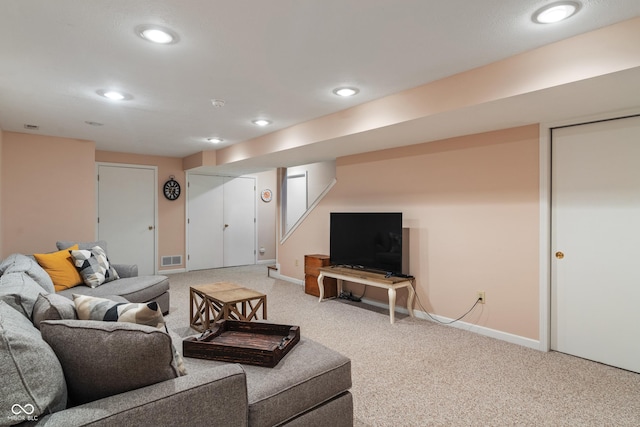 living room with light colored carpet, baseboards, and recessed lighting
