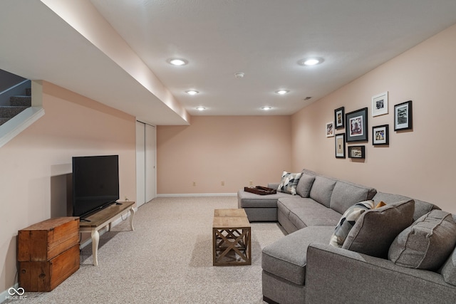 living area with light colored carpet, recessed lighting, baseboards, and stairway
