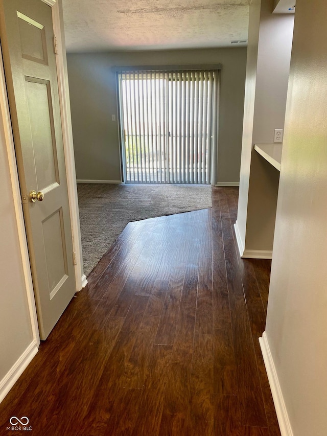 1150 Canterbury Ct Apt D, Indianapolis, IN 46260 - empty room featuring baseboards and hardwood / wood-style flooring