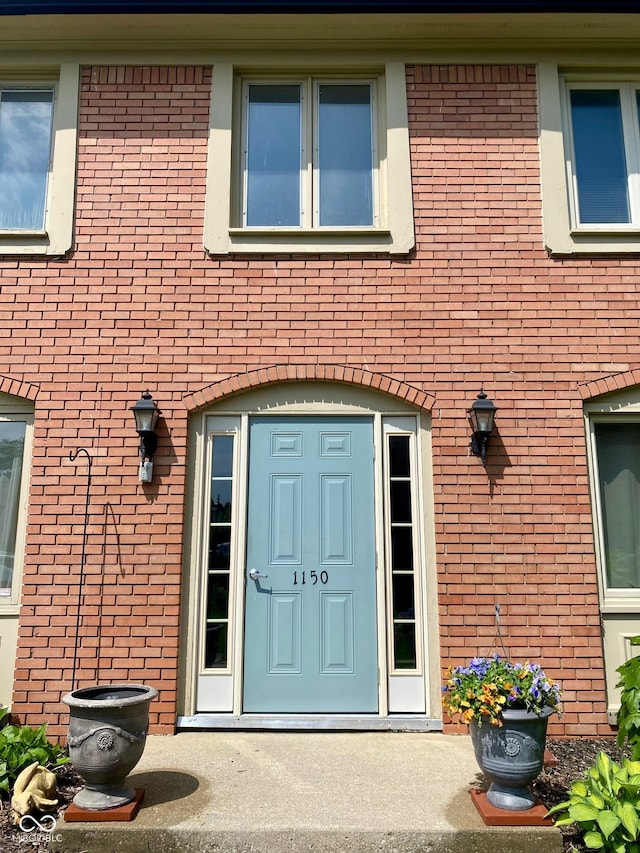 1150 Canterbury Ct Apt D, Indianapolis, IN 46260 - view of exterior entry featuring brick siding