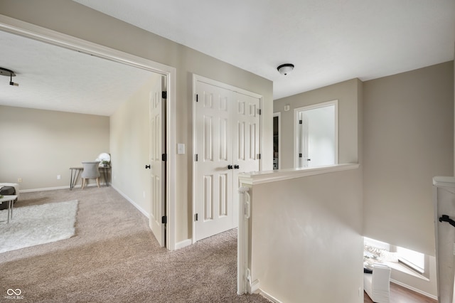 12331 Chiseled Stone Dr, Fishers, IN 46037 - corridor featuring carpet floors and an upstairs landing