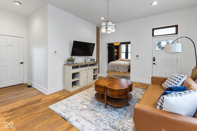 1730 Hoyt Ave, Indianapolis, IN 46203 - living area with light wood finished floors, baseboards, a chandelier, and recessed lighting