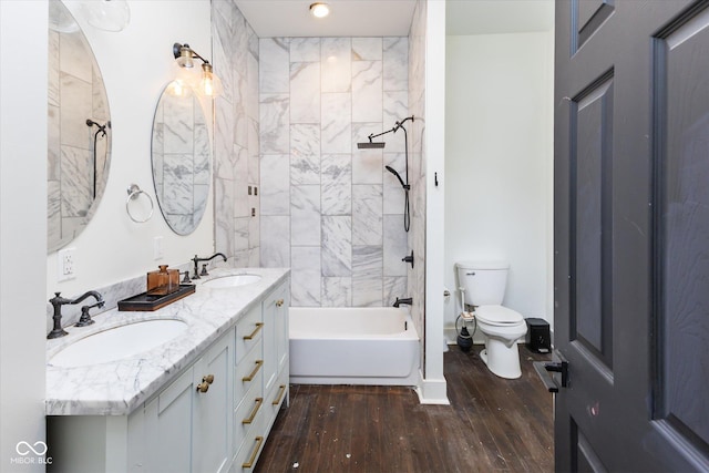 1730 Hoyt Ave, Indianapolis, IN 46203 - full bathroom featuring hardwood / wood-style floors, toilet, double vanity, and shower / bath combination