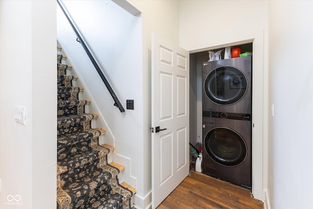 1730 Hoyt Ave, Indianapolis, IN 46203 - laundry room with stacked washer / drying machine, wood finished floors, and baseboards