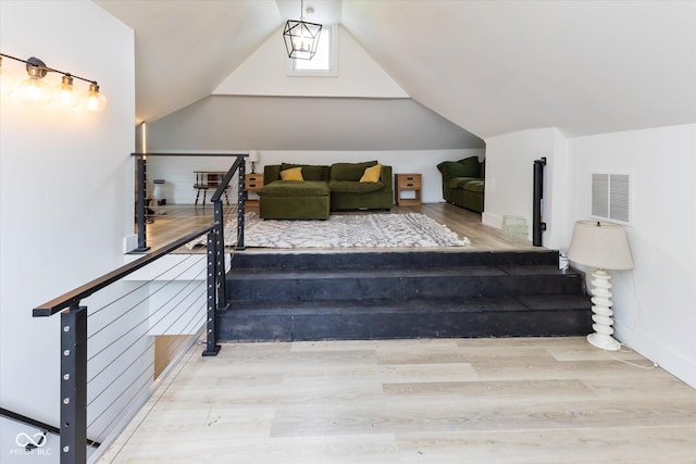 1730 Hoyt Ave, Indianapolis, IN 46203 - stairway featuring vaulted ceiling, wood finished floors, and baseboards