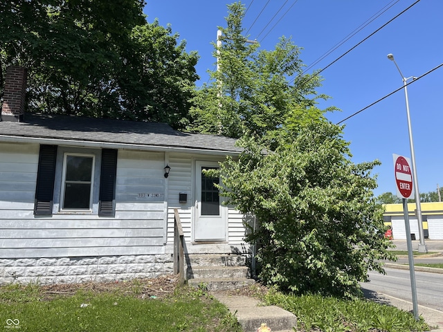 903 W 22nd St, Anderson, IN 46016 - view of front of property with entry steps and a chimney