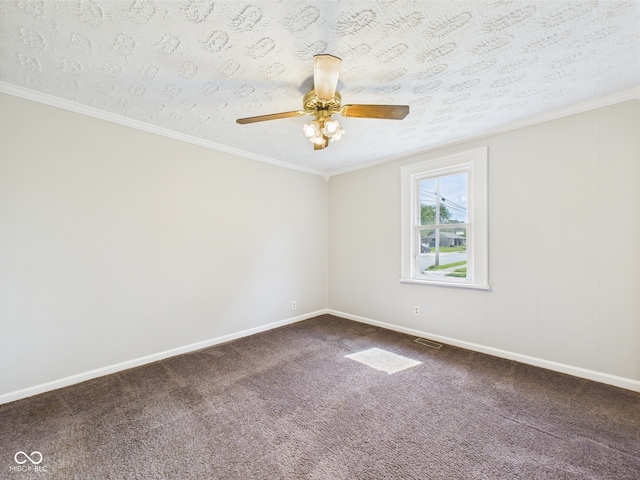 903 W 22nd St, Anderson, IN 46016 - spare room with dark carpet, ceiling fan, baseboards, and ornamental molding